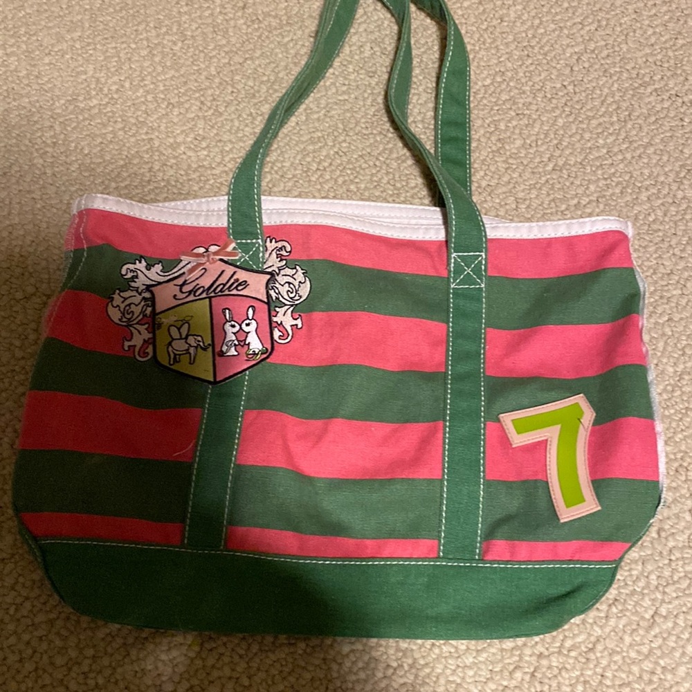 Goldie green and pink cloth tote with cute embroidery in front and back.